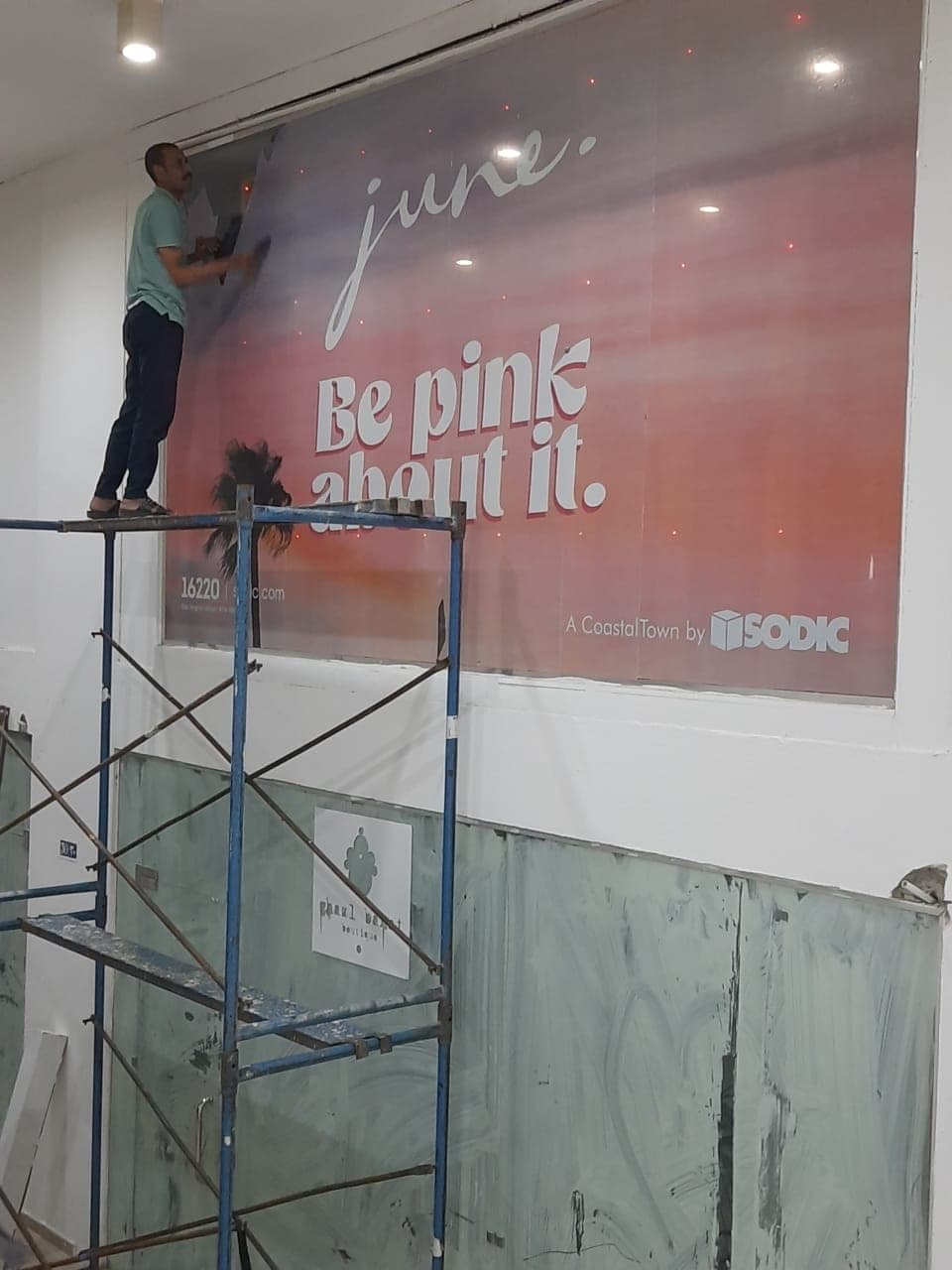 A large-format graphic being installed on site